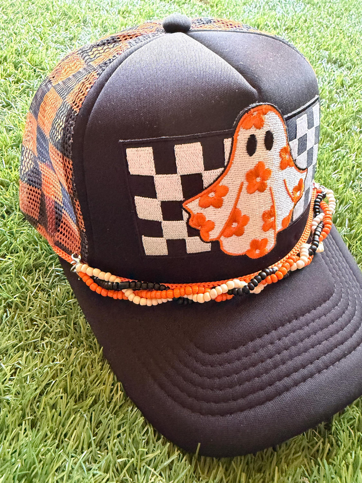 Ghost with floral sheet on custom mesh trucker hat with braided hat chain
