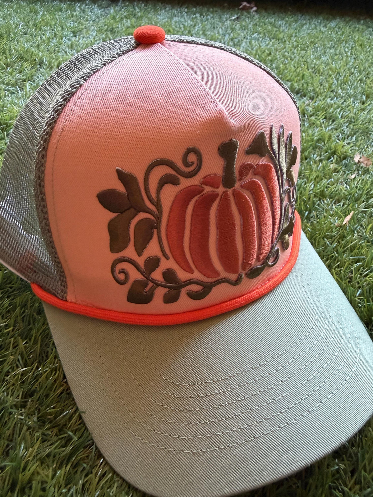 Pumpkin embroidered patch on custom canvas front trucker hat with mesh back