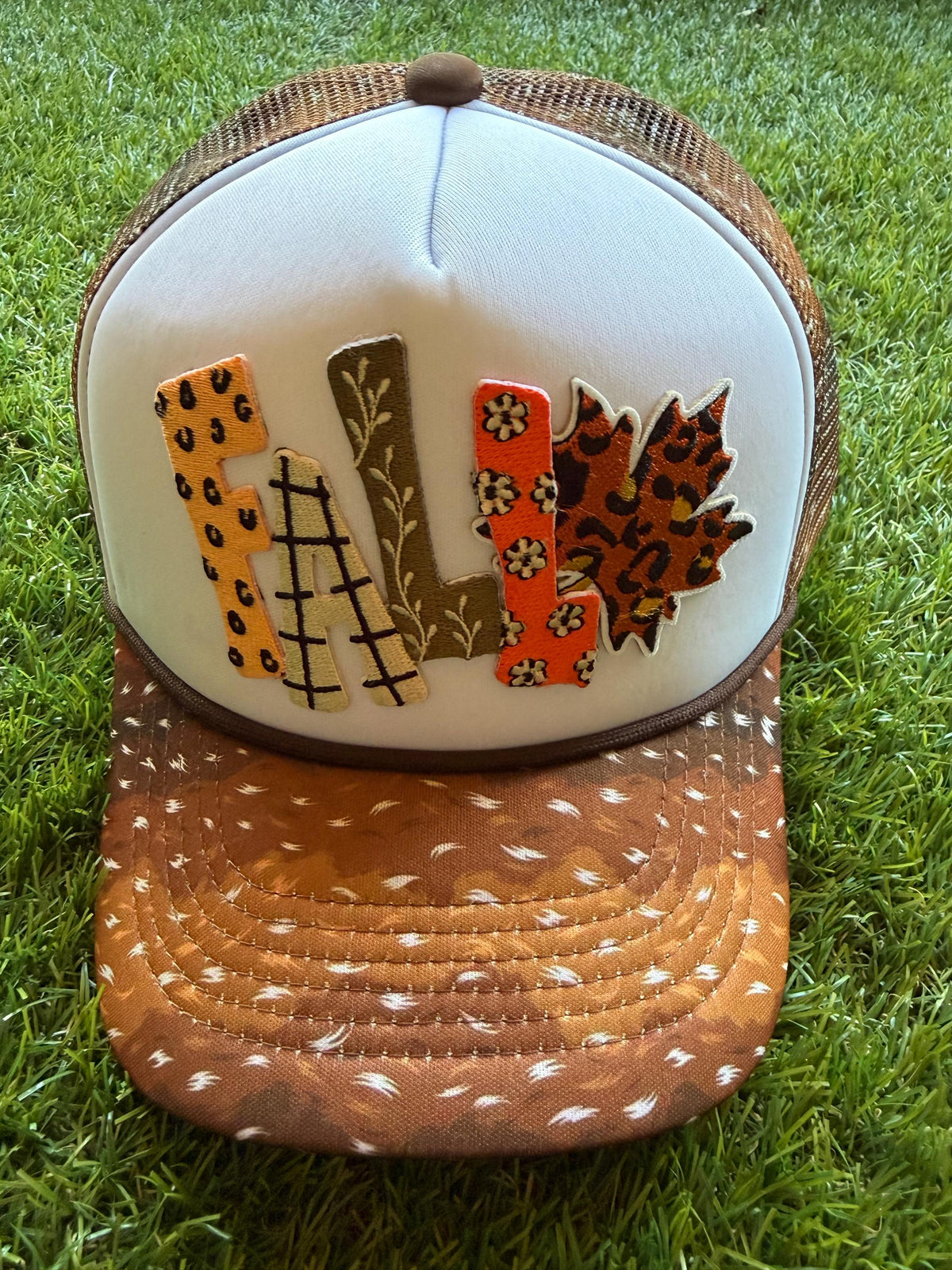 FALL on custom mesh trucker hat with deer print brim and mesh