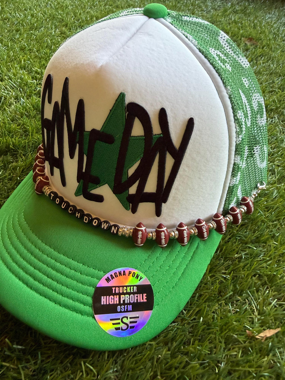 GAMEDAY with green star embroidered patch on custom mesh trucker hat with hat chain