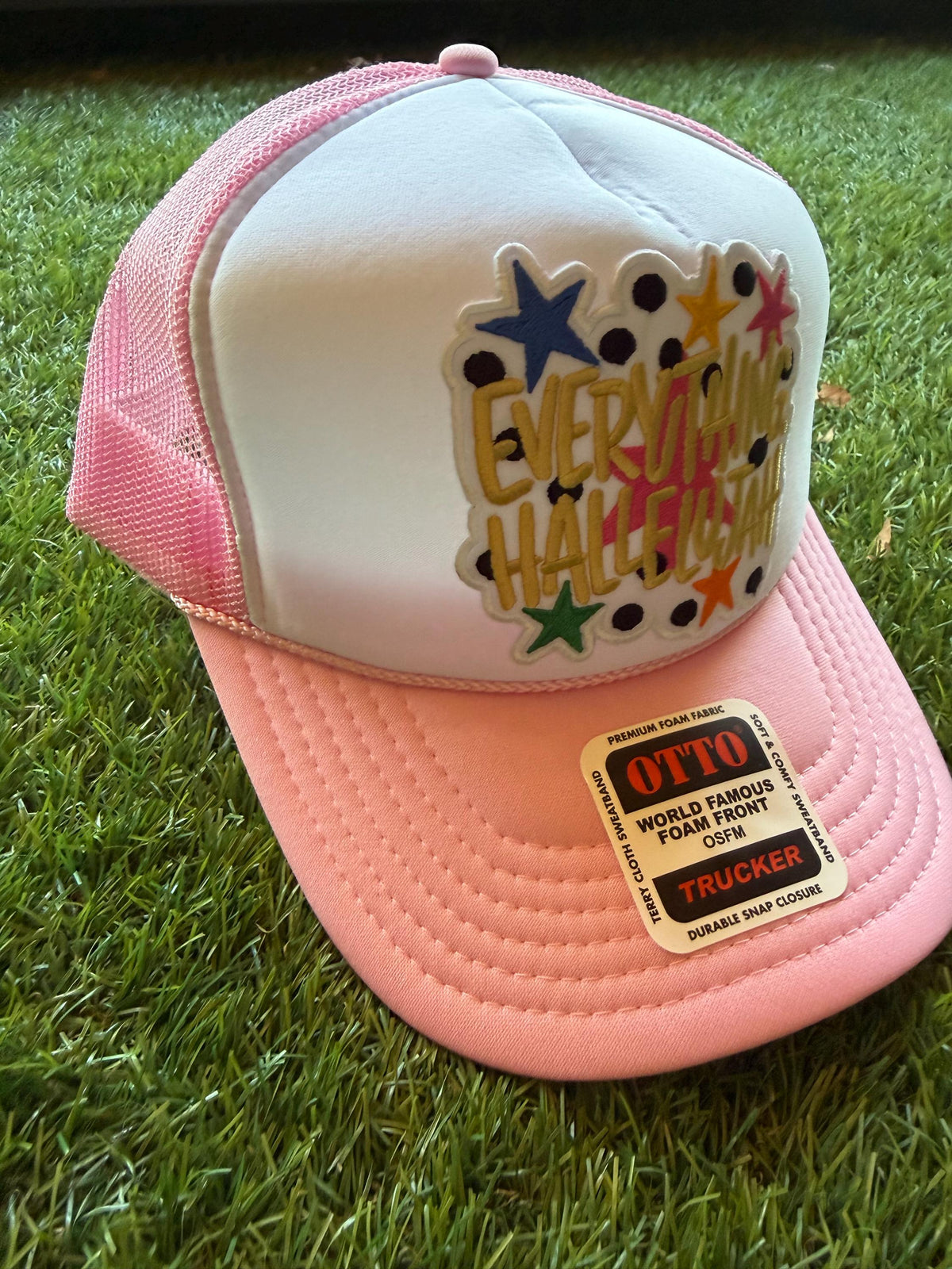 Everything Hallelujah embroidered patch on an Otto light pink custom mesh trucker hat