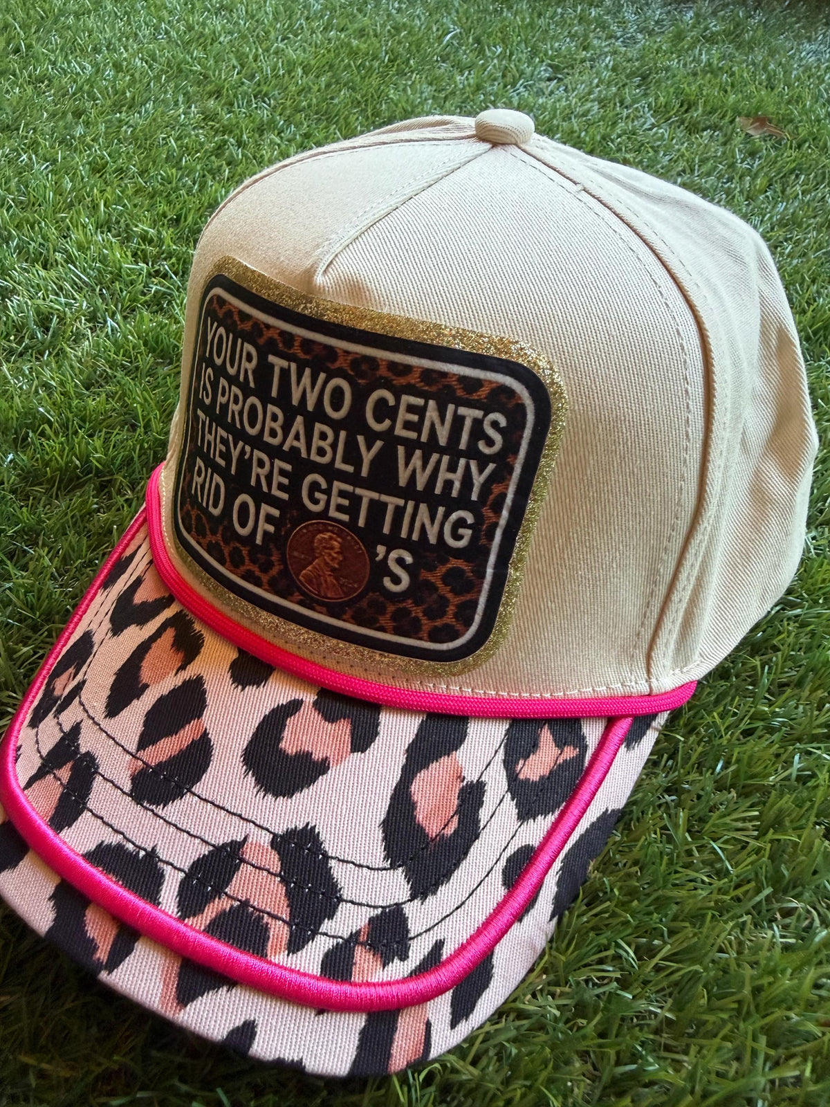 Your Two Cents Are Probably Why They Are Getting Rid of Pennies on a custom canvas trucker hat with leopard brim and hot pink detail
