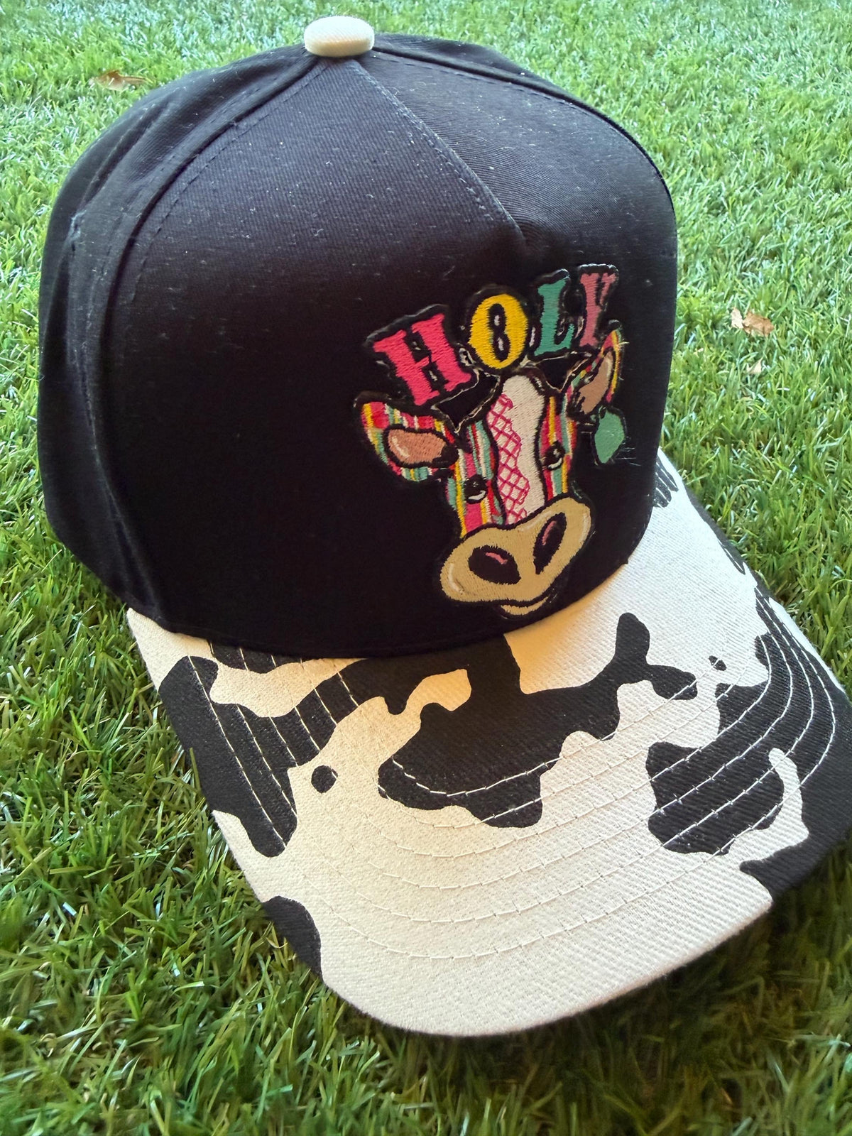 Holy Cow on a custom canvas trucker hat with cow brim