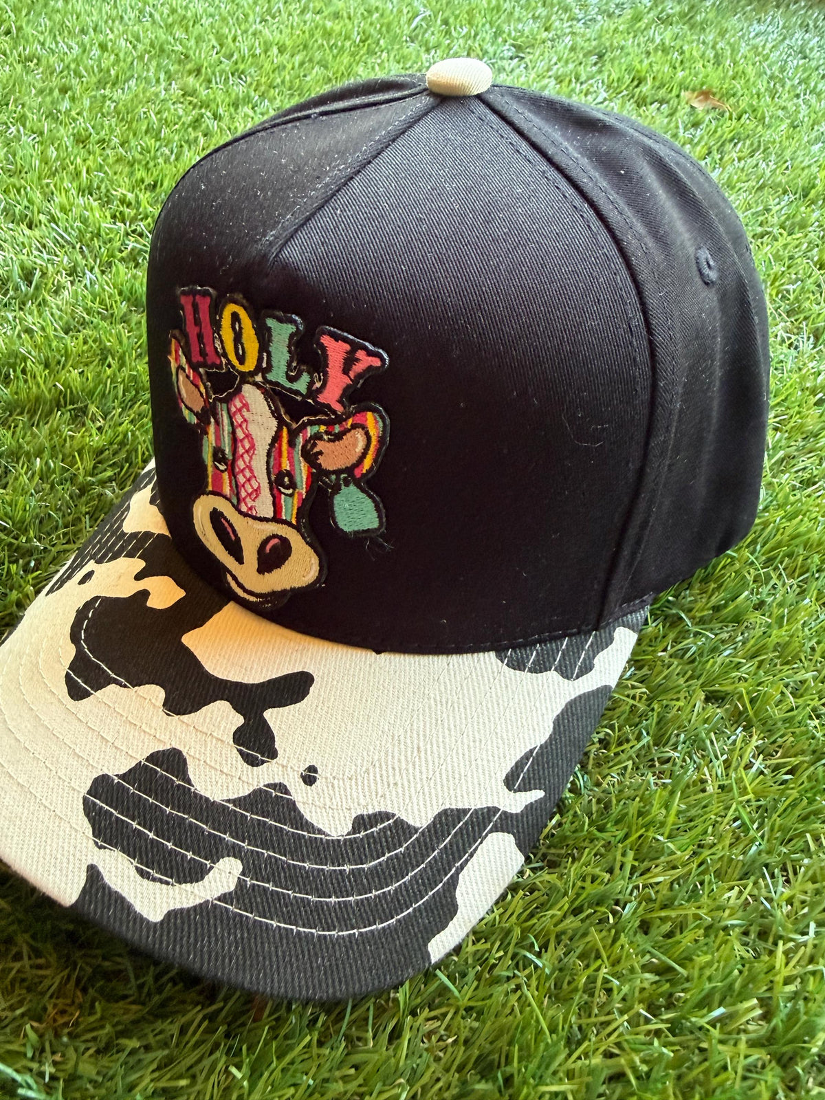 Holy Cow on a custom canvas trucker hat with cow brim